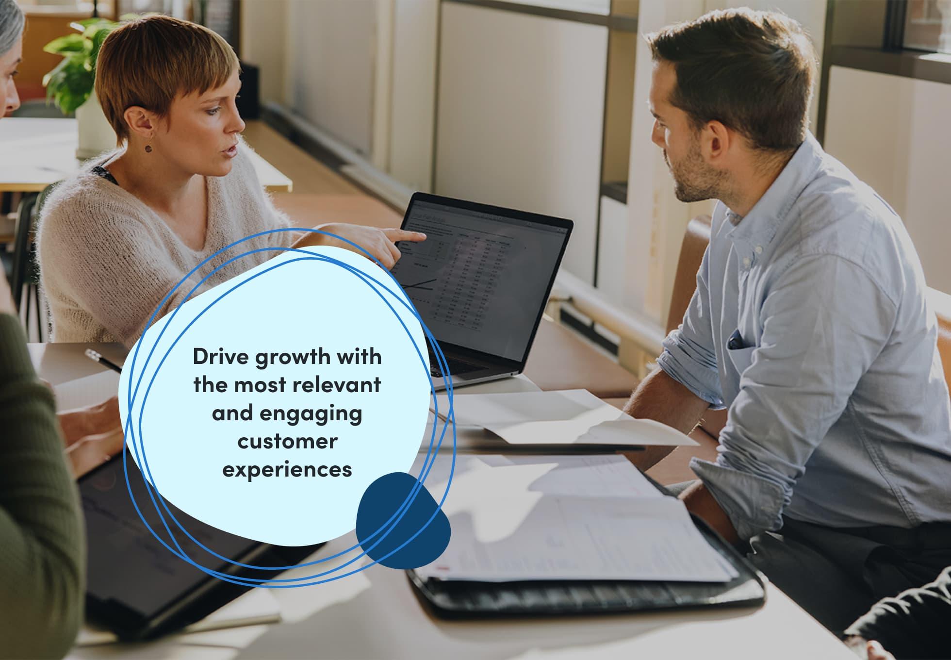 A group of coworkers sitting together and looking at a laptop screen. Words imposed on the image says, "Drive growth with the most relevant and engaging customer experiences."