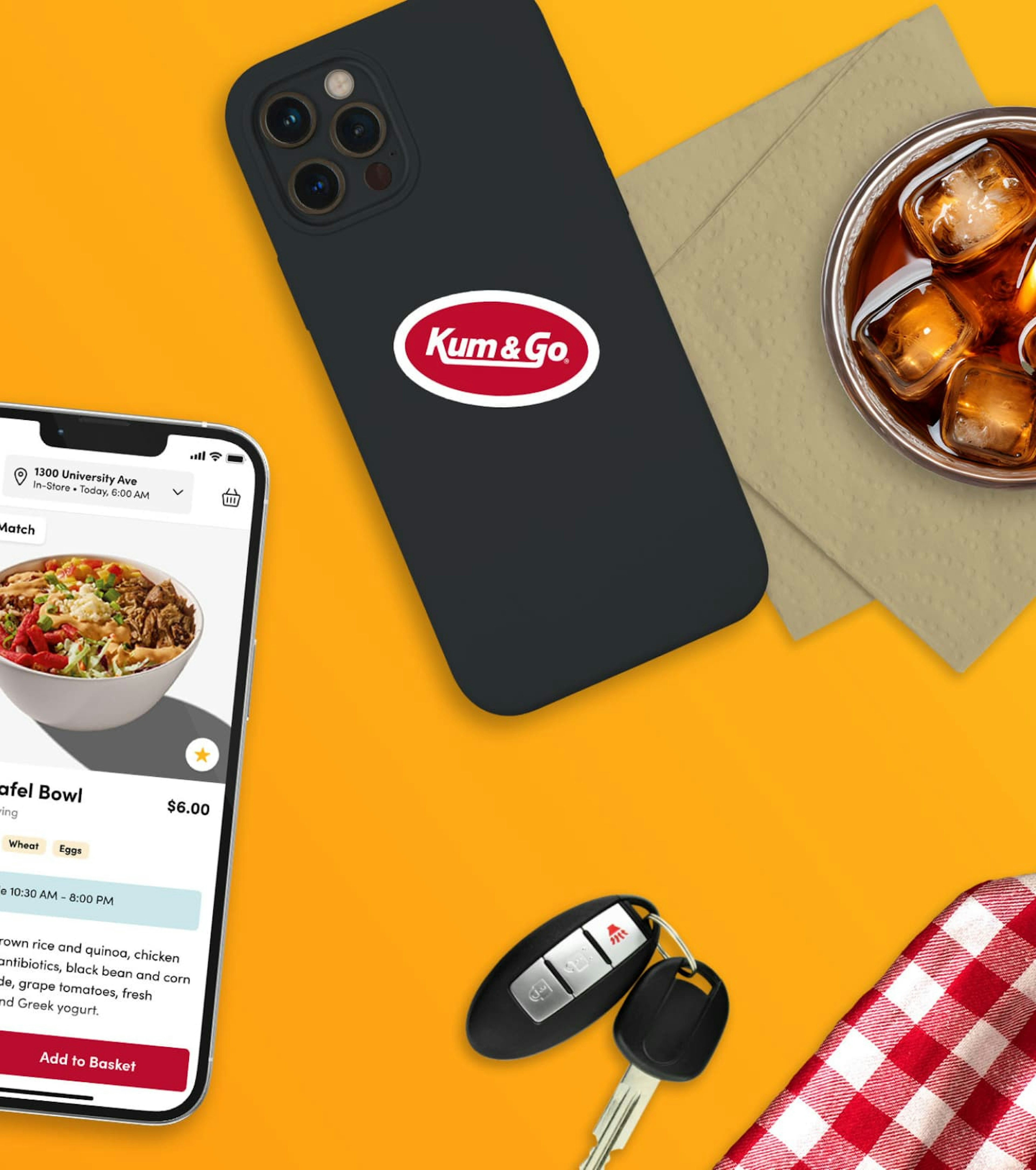 Kum & Go website on an iPhone screen, surrounded by food and drinks that can be purchased through the mobile app.