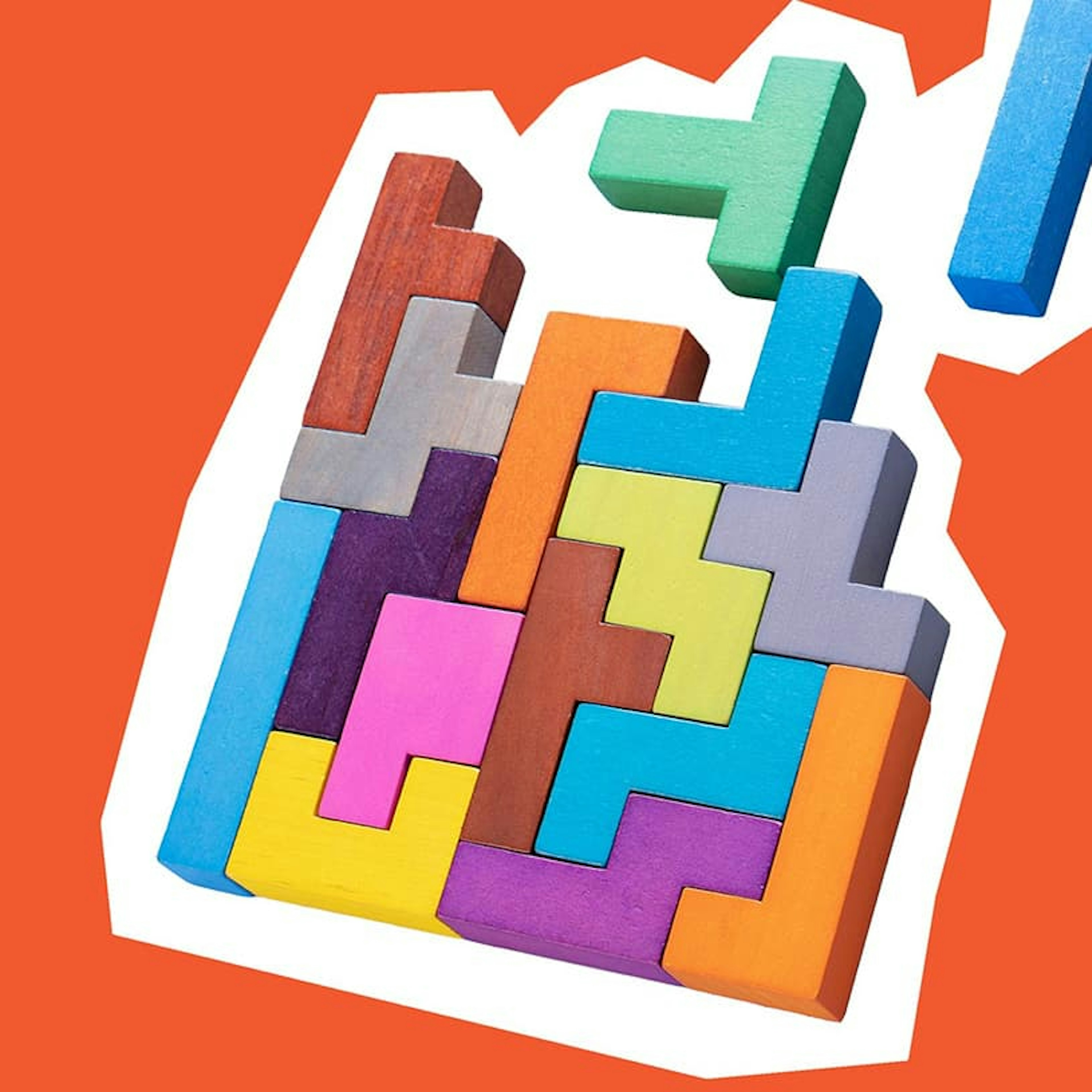 Colorful wooden Tetris game pieces on a bright orange background, representing composability.