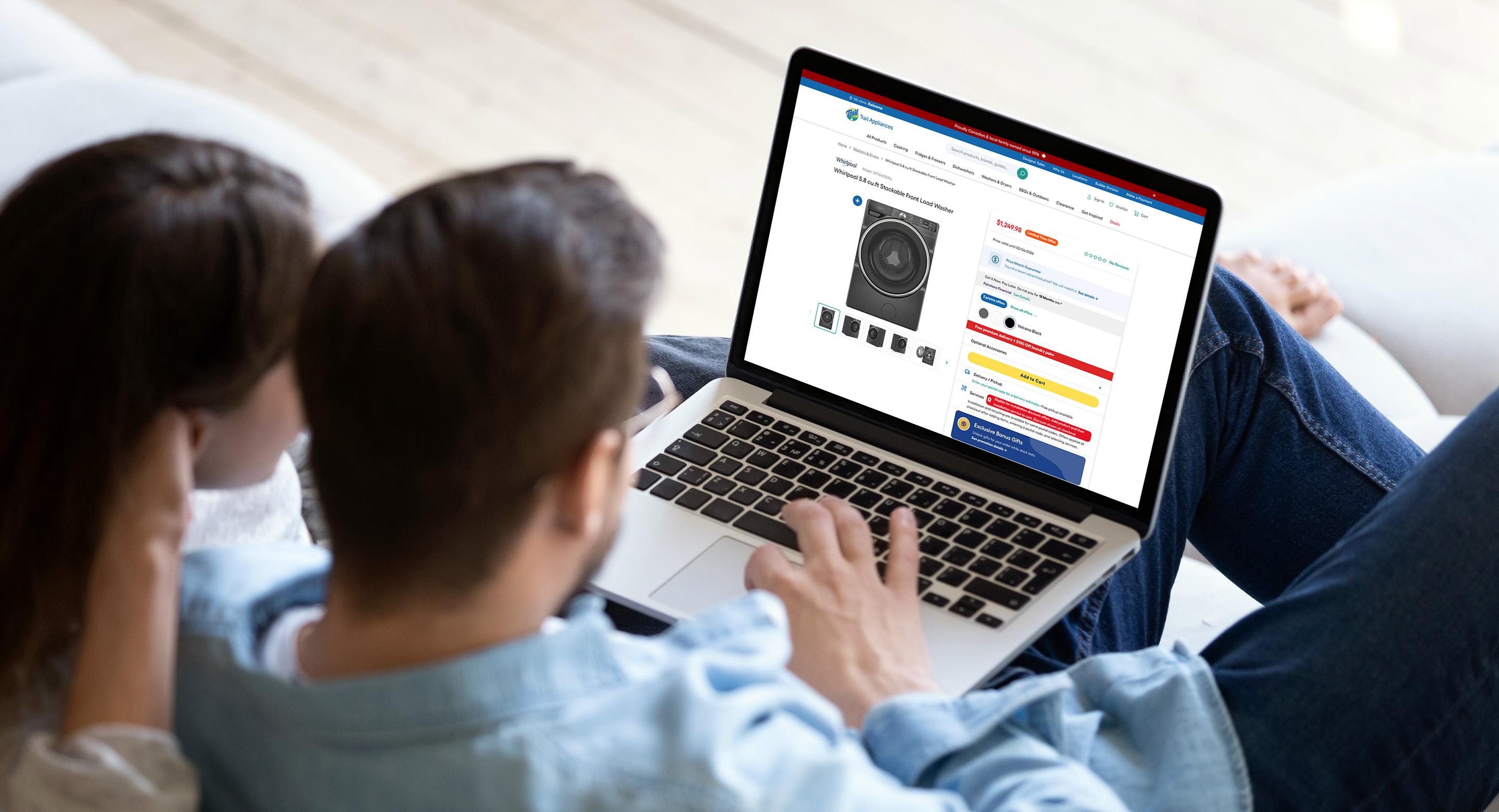 Customer browsing appliances in a Trail Appliances showroom.