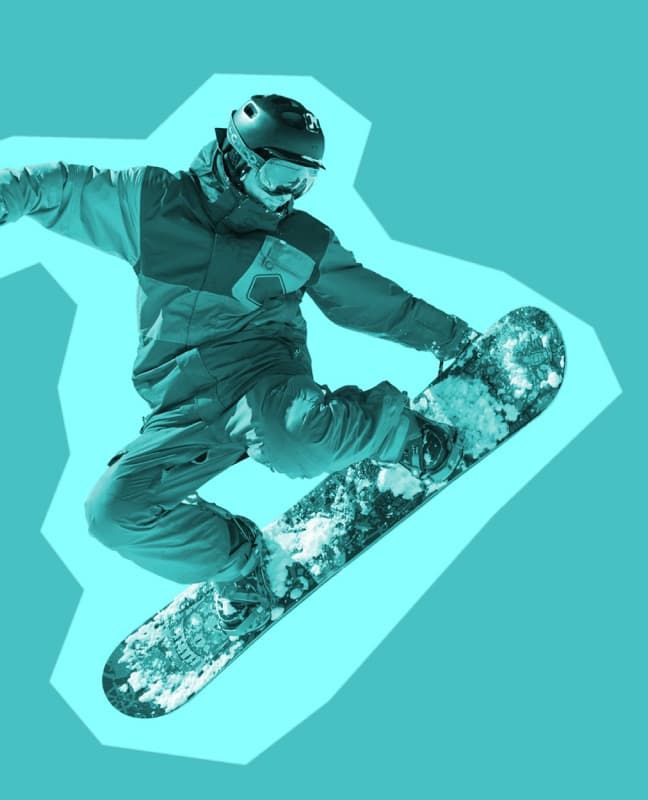 A person on a snowboard in the air.