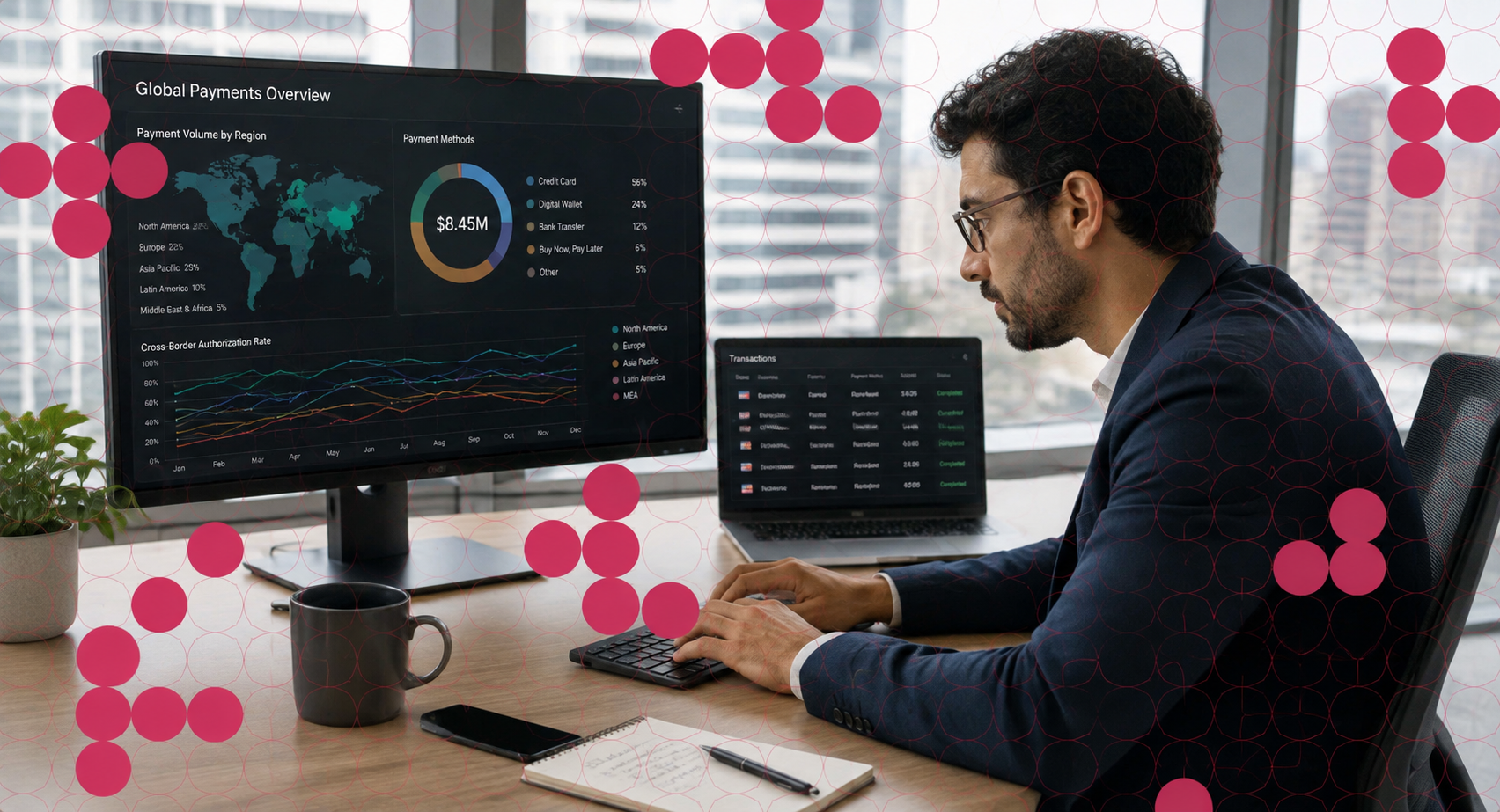 A man sits at a desk reviewing payments data.