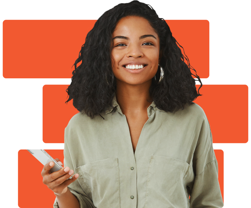 A woman wearing a green button down shirt is holding a cellphone and smiling.