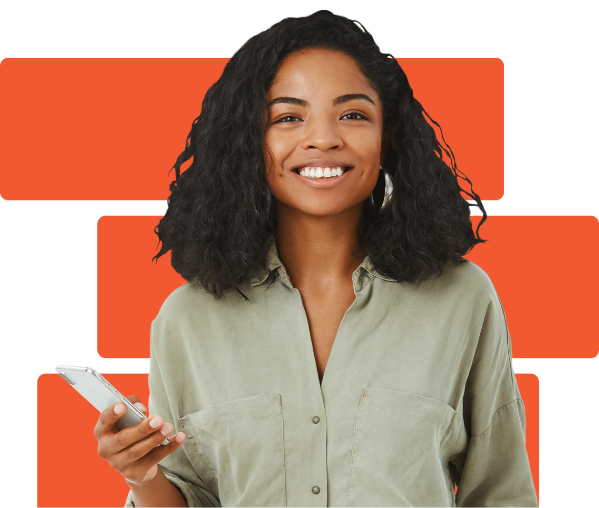 A woman wearing a green button down shirt is holding a cellphone and smiling.