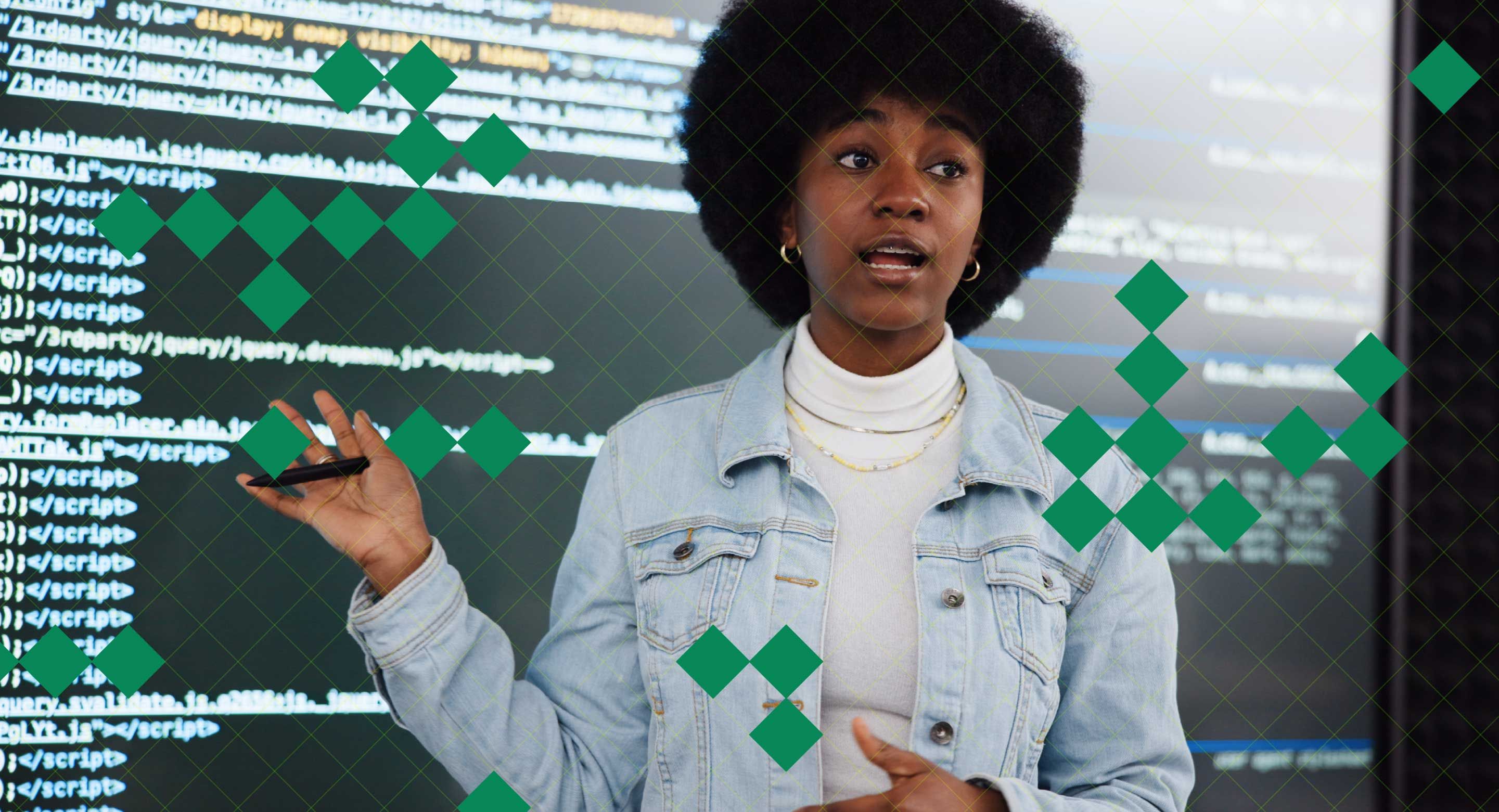 A woman presents in front of a screen displaying code, with a green diamond overlay.
