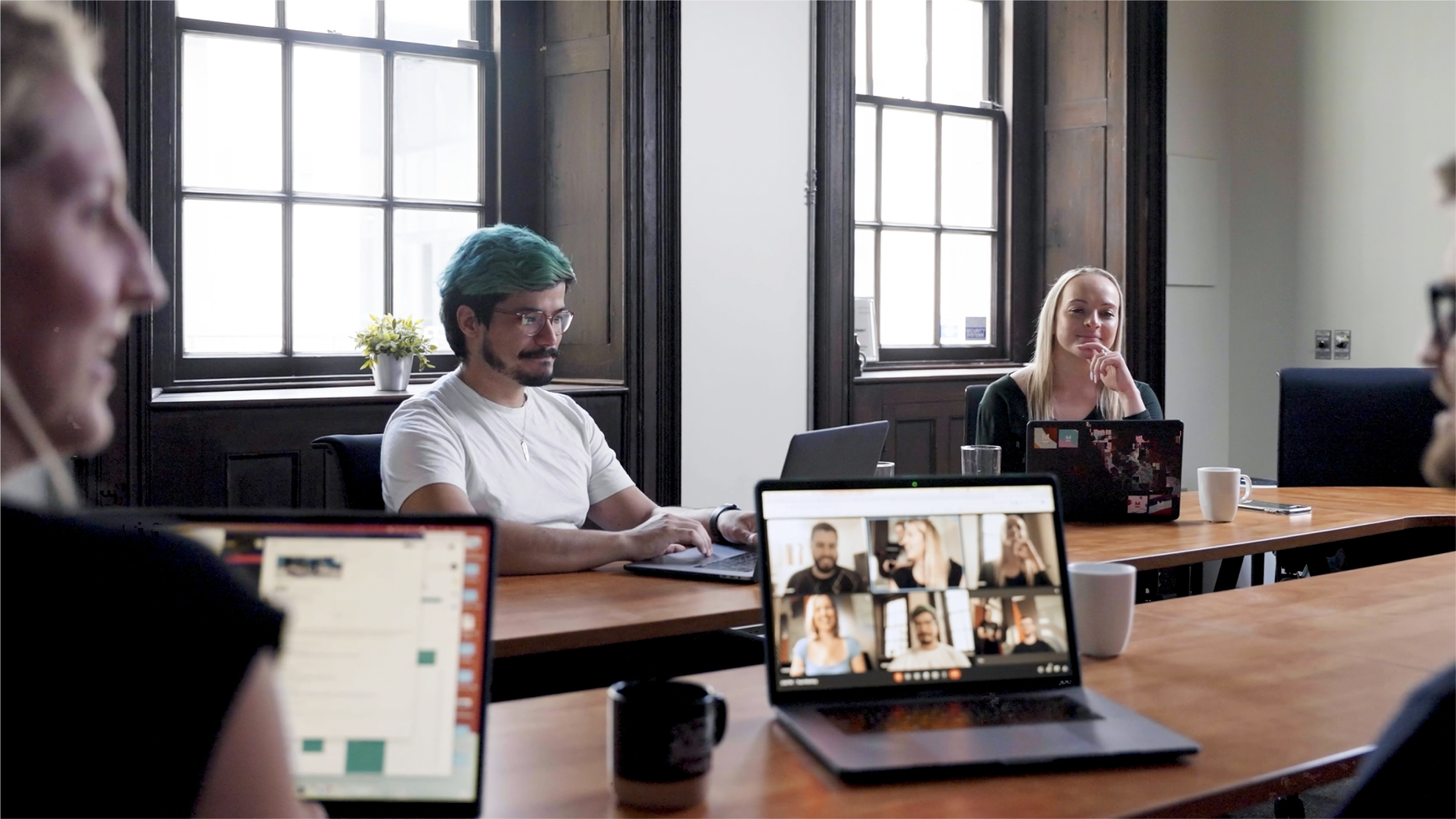 Orium employees meeting in the boardroom