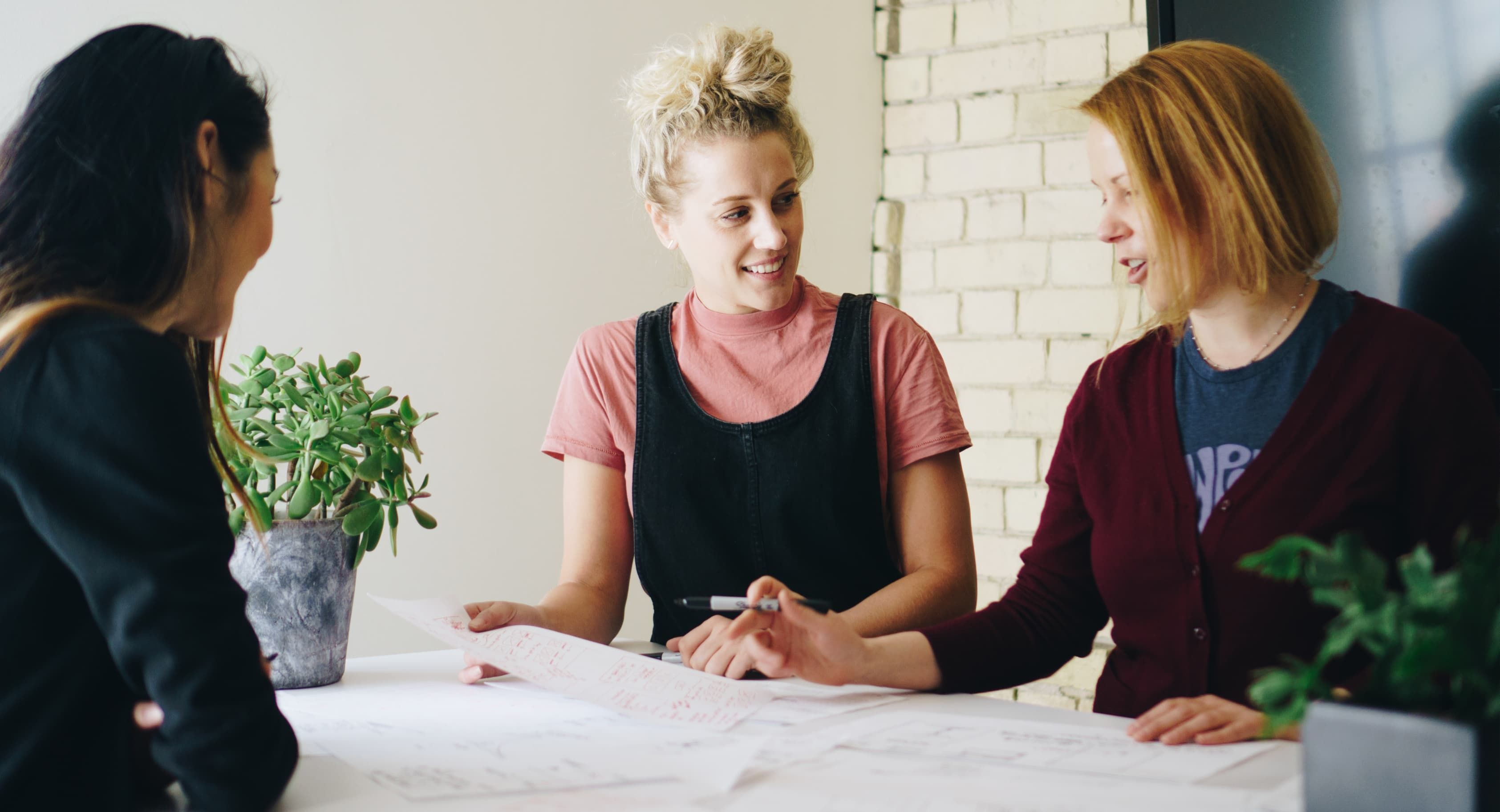 A group of Orium employees brainstorming on a project.