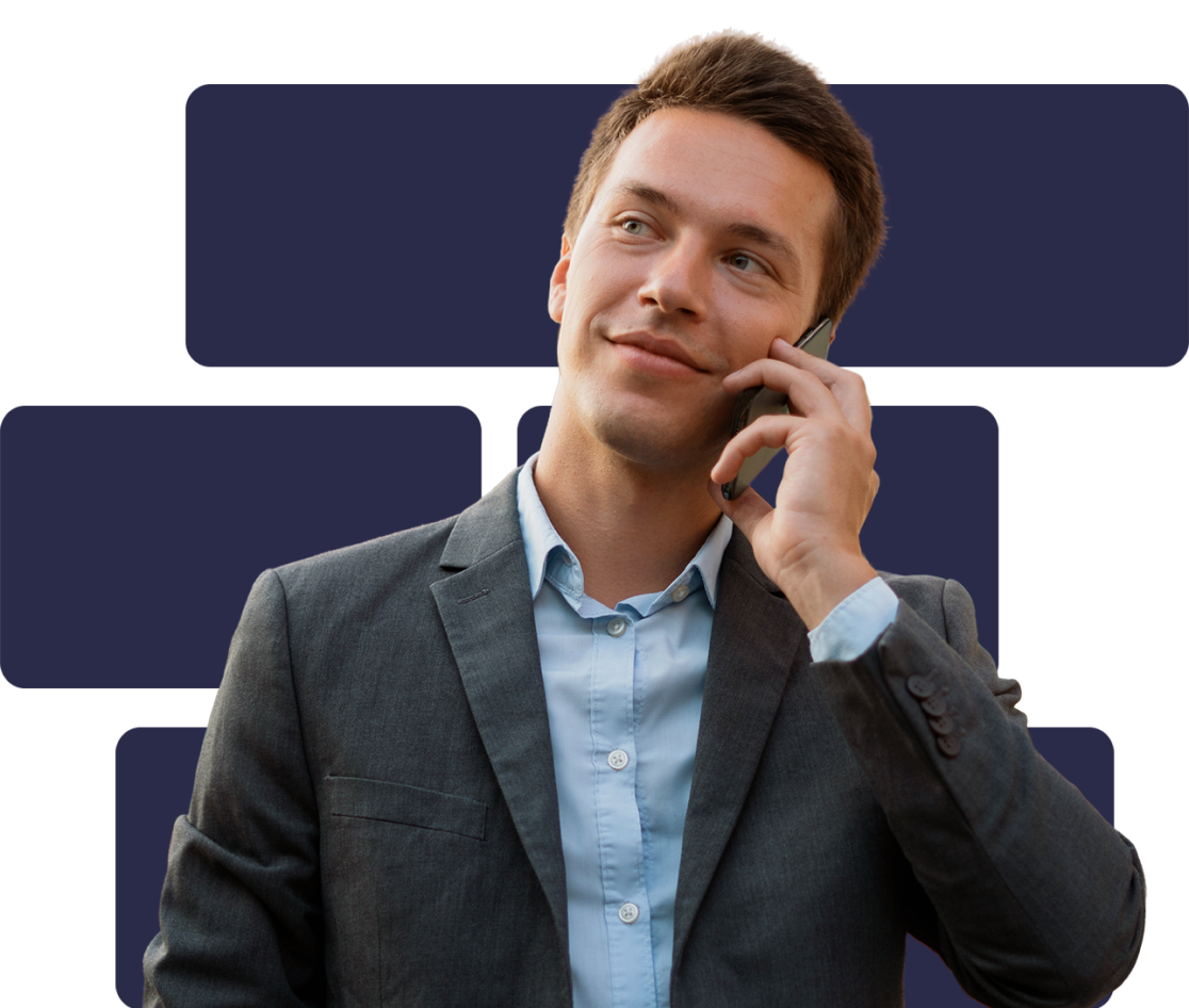 A man wearing a grey suit and blue shirt is on a phone call, looking thoughtfully to the side. The background behind him is dark purple rectangles on a lighter purple.
